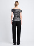 Back full length image of model wearing Allegra Top In Silk Nylon in BLACK