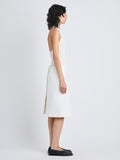 Side full length image of model wearing Adele Skirt In Eco Cotton Twill in EGGSHELL