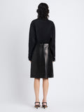 Back image of model wearing Adele Skirt In Leather in black