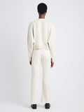 Back full length image of model wearing Sofia Cardigan In Eco Cashmere in IVORY