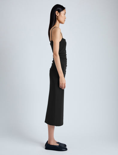 Side image of model wearing Blaire Dress in Viscose Jersey in black