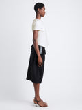 Side image of model wearing Maren Top in Eco Cotton Jersey in bone