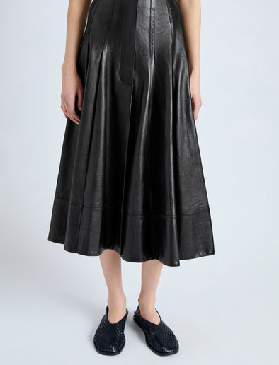 Detail image of model wearing Moore Skirt in Glossy Leather in BLACK