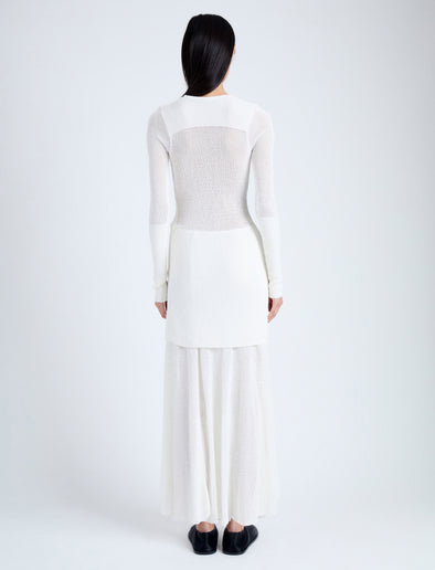 Back full length image of model wearing Anita Knit Dress in Sheer Mesh in OFF WHITE