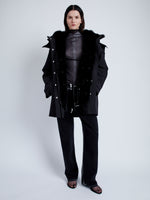 Front full length image of model wearing Wilder Coat In Technical Nylon in Black