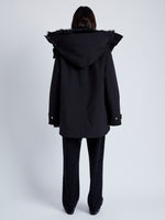 Back full length image of model wearing Wilder Coat In Technical Nylon in Black