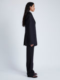 Side full length image of model wearing Archer Jacket In Wool Twill in Black