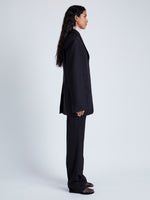 Side full length image of model wearing Archer Jacket In Wool Twill in Black