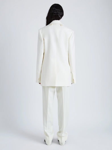 Proenza Schouler Back full length image of model wearing Archer Jacket in Wool Twill Suiting in WAX