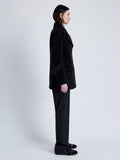Side full length image of model wearing Rowen Peacoat In Eco Double Face Wool in Black