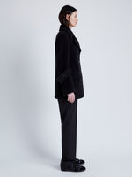 Side full length image of model wearing Rowen Peacoat In Eco Double Face Wool in Black