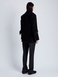 Back full length image of model wearing Rowen Peacoat In Eco Double Face Wool in Black