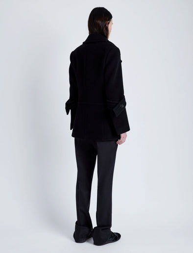 Proenza Schouler Back full length image of model wearing Rowen Coat in Eco Double Face Wool in BLACK