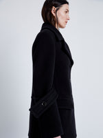 Detail image of model wearing Rowen Peacoat In Eco Double Face Wool in Black