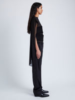 Side full length image of model wearing Aurora Top In Crepe Chiffon / Wool Gabardine in Black