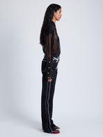 Side full length image of model wearing Smithson Shirt In Silk Knit in Black