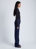 Side full length image of model wearing Alyssa Sweater In Wool Viscose Knit in Charcoal