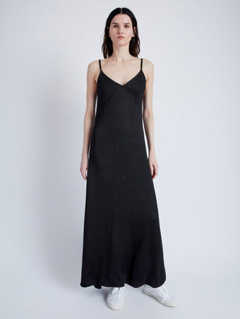 Front image of model wearing Bella Dress in Lacquered Viscose in black