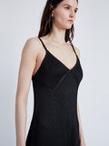 Detail image of model wearing Bella Dress in Lacquered Viscose in black