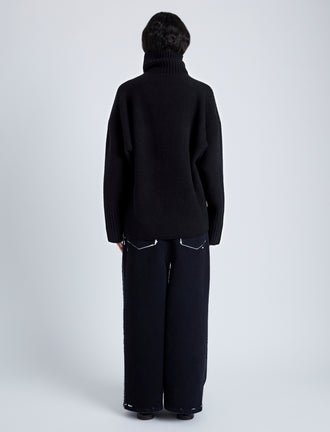 Back full length image of model wearing Yara Sweater In Double Face Cashmere in Black
