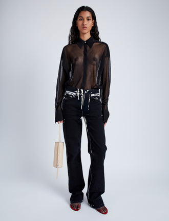 Front image of model wearing Ryman Jean in black multi