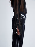 Detail image of model wearing Ryman Jean in black multi