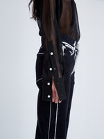 Detail image of model wearing Ryman Jean in black multi