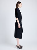 Proenza Schouler Side full length image of model wearing Maisie Dress in Matte Viscose Crepe in BLACK