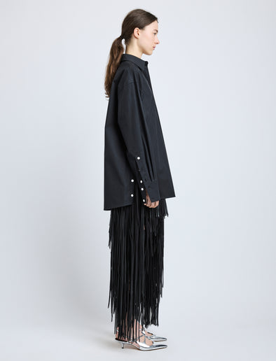 Proenza Schouler Side full length image of model wearing Phia Skirt in Leather Silk Fringe in Black