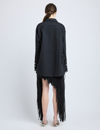 Proenza Schouler Back full length image of model wearing Phia Skirt in Leather Silk Fringe in Black