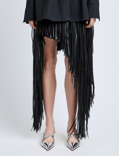 Proenza Schouler Detail image of model wearing Phia Skirt in Leather Silk Fringe in Black
