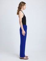 Proenza Schouler side image of model wearing Alexia Pant in Bi-Stretch Suiting in cobalt