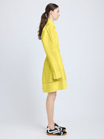 Proenza Schouler Side full length image of model wearing Sammy Dress in Eco Cotton Poplin in Yellow