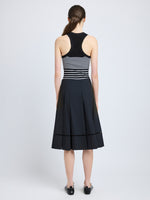 Proenza Schouler Back full length image of model wearing Laci Skirt in Eco Cotton Poplin in Black