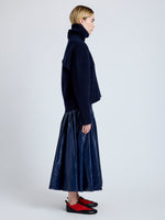 Proenza Schouler Side full length image of model wearing Petra Skirt in Lacquered Cotton in Navy