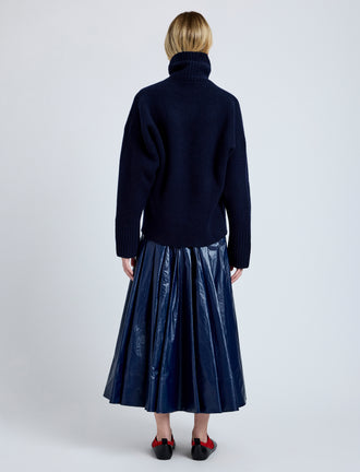 Proenza Schouler Back full length image of model wearing Petra Skirt in Lacquered Cotton in Navy