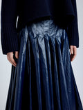Proenza Schouler Detail image of model wearing Petra Skirt in Lacquered Cotton in Navy