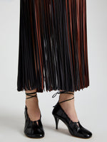 Proenza Schouler Detail image of model wearing Veda Skirt in Faux Leather Fringe in Brown Multi