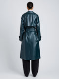 Proenza Schouler Back full length image of model wearing Benedetta Trench Coat in Coated Cotton in Bottle Green