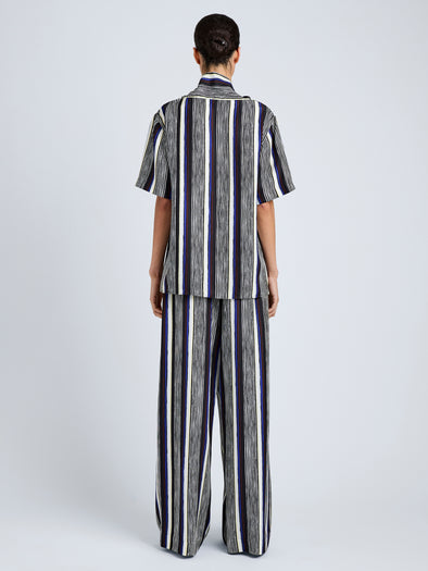 Proenza Schouler Back full length image of model wearing Amira Pant in Printed Silk Habotai in Black Multi