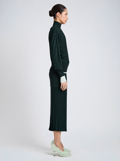 Proenza Schouler Side full length image of model wearing Luiza Skirt in Sunburst Rib in Bottle Green
