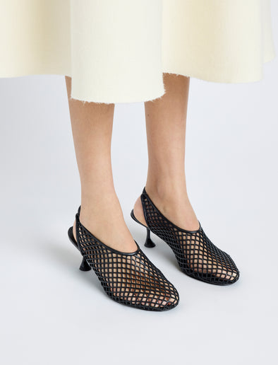 Image of model wearing Tee Perforated Slingback Pumps in BLACK
