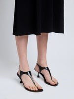 Image of model wearing Tee Thong Sandals in Black