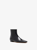 3/4 Front image of Trap Flat Ankle Boots In Nappa Leather in Black