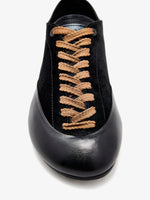 Proenza Schouler aerial image of Arcadia Sneakers in black with tan laces