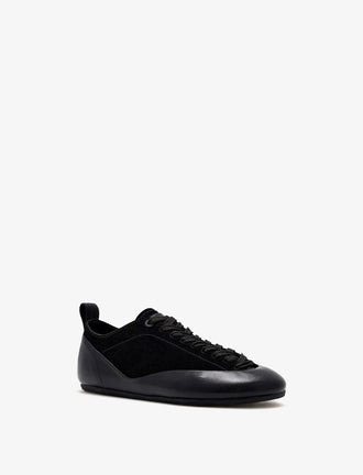 Proenza Schouler front 3/4 image of Arcadia Sneakers in black with black laces