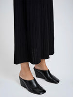 Proenza Schouler Image of model wearing Slant Mules in Slick Calf in Black