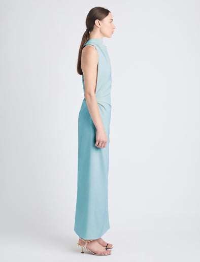Side image of model wearing Selena Twist Back Dress in Matte Viscose Crepe in pale blue