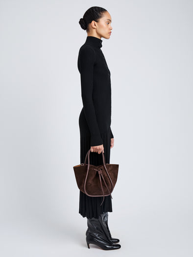 Proenza Schouler Image of model holding Small Ruched Tote in Soft Suede in Chocolate