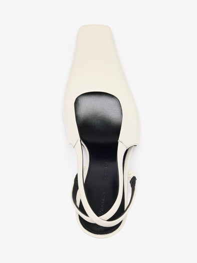 Proenza Schouler aerial image of Trap Cross Slingback Pumps in Spazzolato Leather in ecru